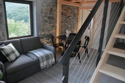a living room with a couch and a table at Viktor Estate in Deskle