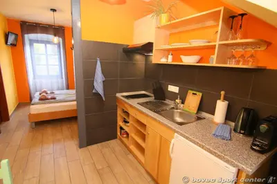 a kitchen with a sink and a counter top at Apartments Bovec House Center in Bovec