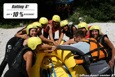 a group of people on a raft on a river at Apartments Bovec House Center in Bovec