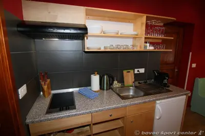 a kitchen with a sink and a counter top at Apartments Bovec House Center in Bovec