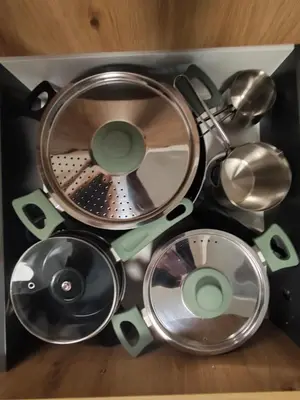 a pile of kitchen utensils in a box at Hiška 4005 - Terme Čatež in Brežice