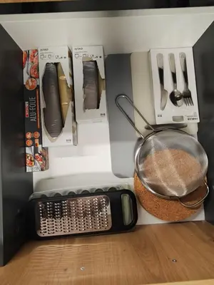 a kitchen with a strainer and a scale on the floor at Hiška 4005 - Terme Čatež in Brežice