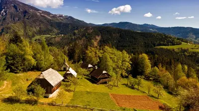 an aerial view of a village in the mountains at Domačija Koklej - Apartments Vintage Vacation in Luče
