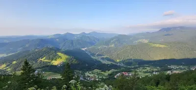 a view of a valley in the mountains at Apartments Na Žagi in Železniki