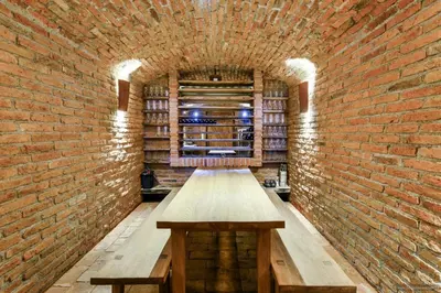 a room with a brick wall and a wooden bench at Exklusive Premium-Lodge mit Pool, Sauna, Gästehaus