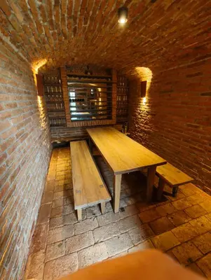 a room with two benches in a brick wall at Exklusive Premium-Lodge mit Pool, Sauna, Gästehaus