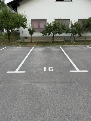 a parking lot with the number written on it at Andro's modern studio apartment in Ljubljana