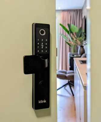 a remote control hanging on a wall in a kitchen at Green Heart Suites in Podljubelj