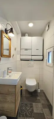 a bathroom with a sink and a toilet at Riva Residence in Old Town Ljubljana by the Cobblers' Bridge in Ljubljana