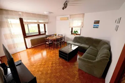 a living room with a couch and a table at Apartma PR ČEHC in Tolmin