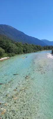 a river with a group of people in the water at Apartma PR ČEHC in Tolmin