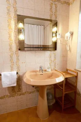 a bathroom with a sink and a mirror at Apartma PR ČEHC in Tolmin