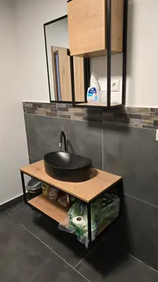 a sink on a wooden table in a kitchen at Apartma Alja 4 Kranjska Gora in Kranjska Gora