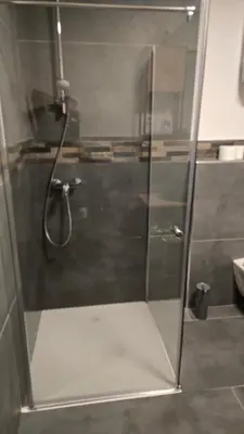 a shower with a glass door in a bathroom at Apartma Alja 4 Kranjska Gora in Kranjska Gora