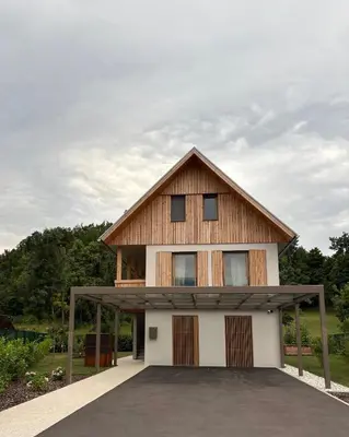 a large house with a gambrel roof at AvantGarden in Bled