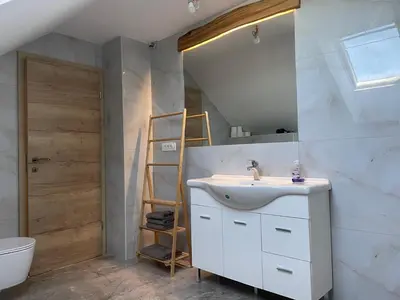 a bathroom with a sink and a mirror at Zerko Holiday Apartment Janko with JACUZZI and SAUNA in Mirna