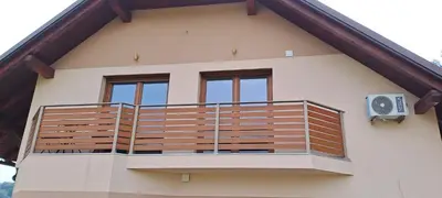 a balcony on the side of a house at Apartmaji Božiček in Podčetrtek