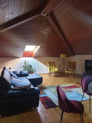 a living room with a couch and chairs at Apartma Morizna in Kobarid