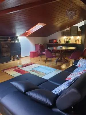 a living room with a couch and a table at Apartma Morizna in Kobarid
