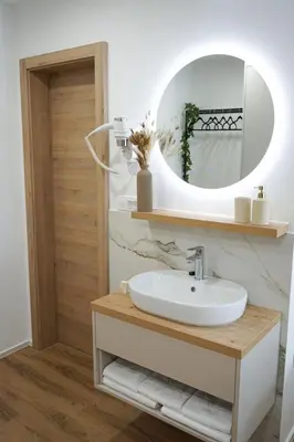 a bathroom with a sink and a mirror at Gostisce Ulipi in Slovenske Konjice
