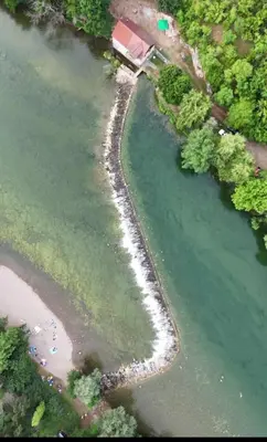 an aerial view of a river next to a beach at Družinski apartmaji Judnič in Adlešiči