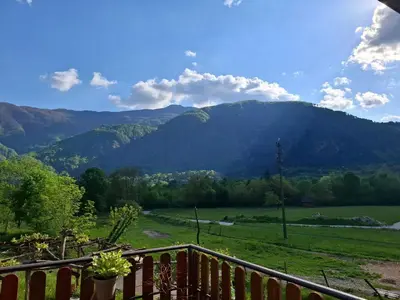 a view of a mountain from the balcony of a house at Kamer Luna in Log Čezsoški