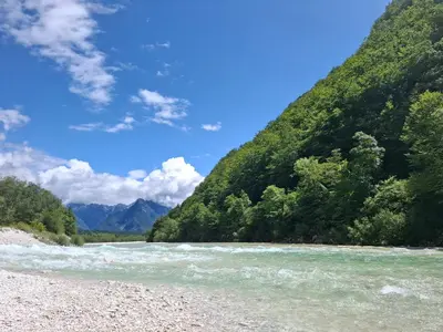 a river in the middle of a mountain at Kamer Luna in Log Čezsoški
