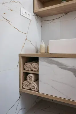 a towel rack in a bathroom with towels at Holiday Home Kamence in Rogaška Slatina