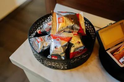 a basket of chips on a counter next to a box at Brioni Hills - Premium Escape in Šmarje pri Jelšah