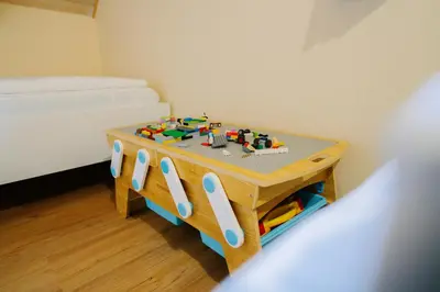 a small table in a room with a bed at Brioni Hills - Premium Escape in Šmarje pri Jelšah