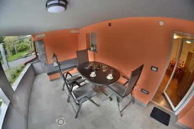 a dining room with a table and chairs at Apartment Arpa in Ljubljana