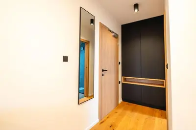 a hallway with a door and a mirror at Vineyard Escape Herbersteinova klet in Juršinci
