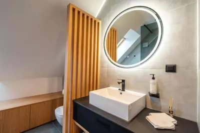 a bathroom with a white sink and a mirror at Vineyard Escape Herbersteinova klet in Juršinci