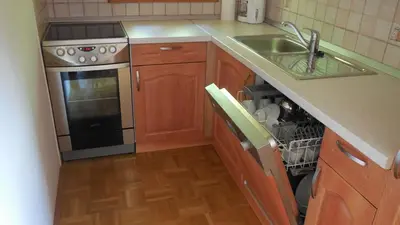 a kitchen with a sink and a stove at Apartments Savinja in Luče