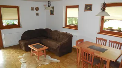 a living room with a couch and a table at Apartments Savinja in Luče