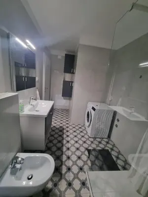 a white bathroom with a sink and a toilet at Vipava Valley Stay - Apartment Miki - With Patio, Parking & Pets OK in Ajdovščina