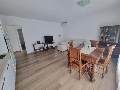 a living room with a table and chairs and a couch at Vipava Valley Stay - Apartment Miki - With Patio, Parking & Pets OK in Ajdovščina