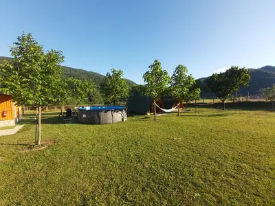 a park with a hammock in the grass at Apartments Petrin in Tolmin