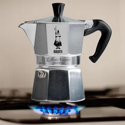a coffee pot sitting on top of a stove at Apartments Petrin in Tolmin