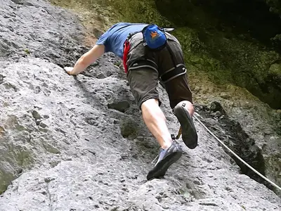 a man walking on a rocky trail at Chalet Iskaretreat in Ig