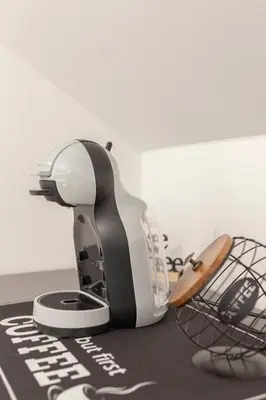 a mixer sitting on top of a table with a basket at Yellow and Green apartments in Ljubljana