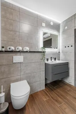 a bathroom with a white toilet and a sink at Apartmaji Gašperčič, NEJC in Bovec