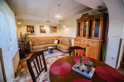 a living room with a table and a couch at B&B Apartment Racman in Brežice