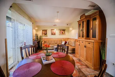 a living room with a table and a couch at B&B Apartment Racman in Brežice