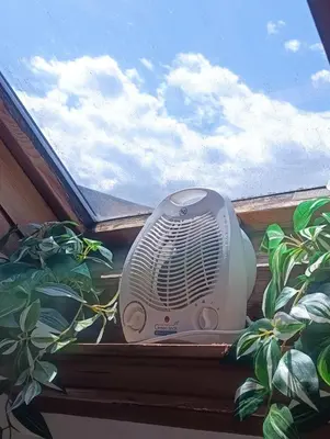 a air conditioner sitting on a window sill at Apartment for families or groups in Ljubljana