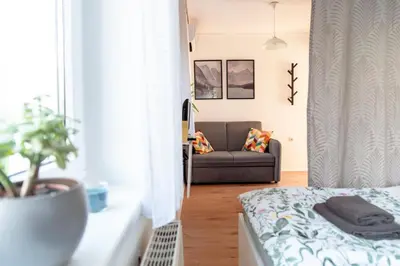 a living room with a couch at Apartments Gorishka in Ljubljana