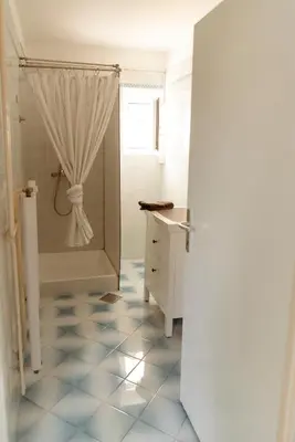 a bathroom with a shower with a shower curtain at Apartments Gorishka in Ljubljana