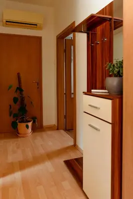 a kitchen with a white refrigerator and a plant at Apartments Gorishka in Ljubljana