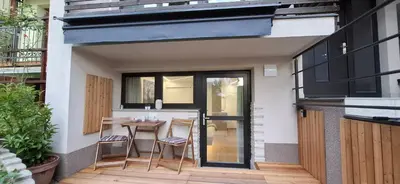 a small patio with a table and chairs at Studio Suha living in Škofja Loka