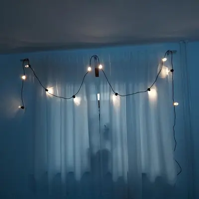 a group of lights on a wall with a curtain at Pr DOLENC in Petrovče